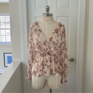 Chenault floral blouse with elastic waist and long sleeves and ruffle detail